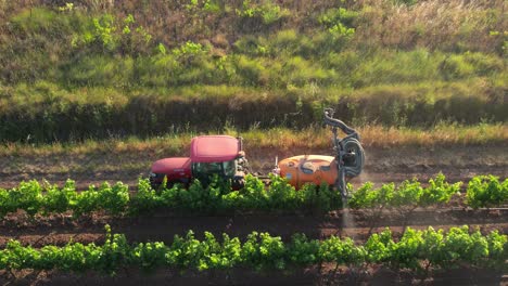 Aerial-tracking-shot-of-Tractor-spraying-toxic-pesticides-in-French-vineyard