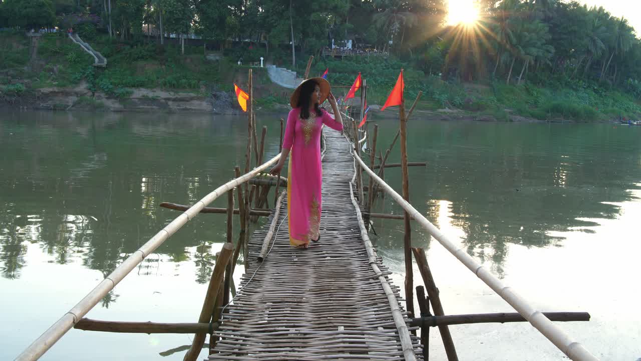 Vietnamese Girl Walking On Bamboo Bridge Cross River With Sunlight, Video In 4K