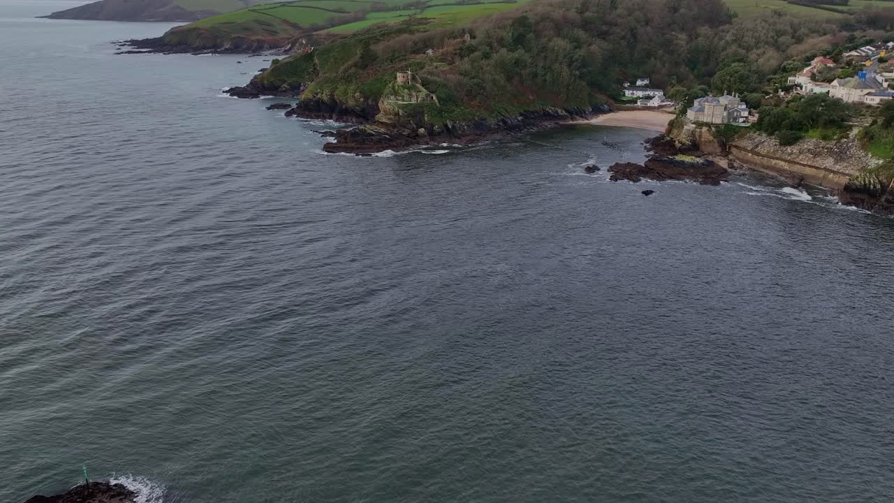 Flying across the river Fowey towards St Catherine's Castle from Polruan in Cornwall