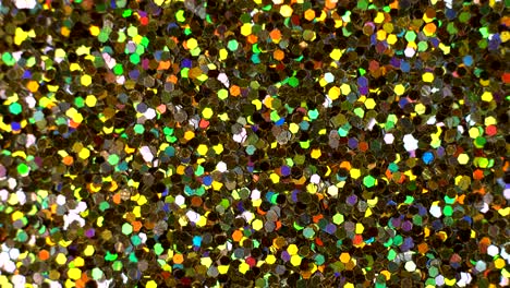 abstract multicolor sequins glitter spin, glowing paillette close-up.