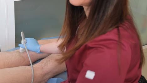 vertical video of a female doctor performing an ultrasound. examination of internal organs is a step towards health. professional diagnostics – reliable control. high quality 4k footage