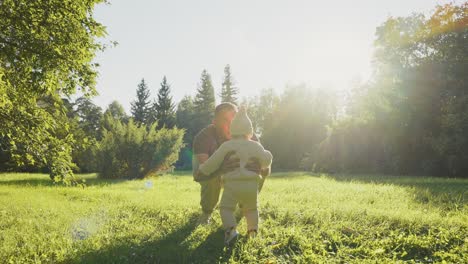 father and baby in park
