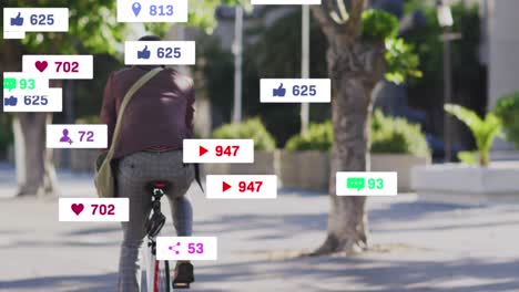 animación de iconos de redes sociales sobre la vista trasera de un hombre afroamericano montando una bicicleta en la calle