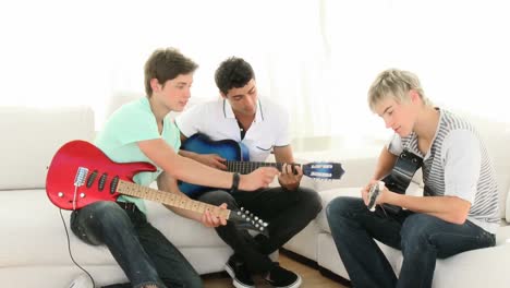 teenagers playing music at home