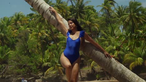 enjoying the caribbean paradise on the island of trinidad, a hispanic girl in a bikini savors the delights of the tropical beach