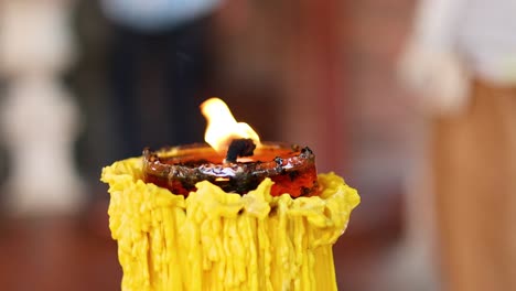 close-up of a burning candle in ayutthaya