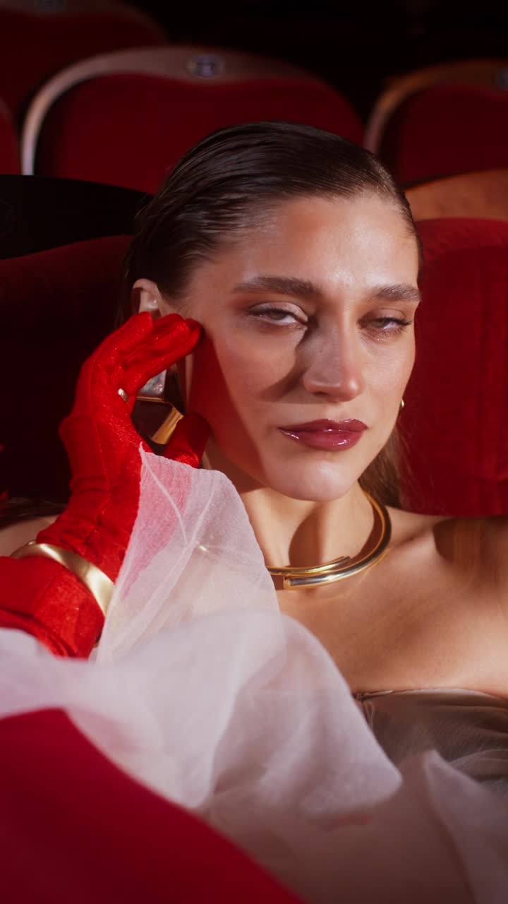 Elegant Woman in Theater