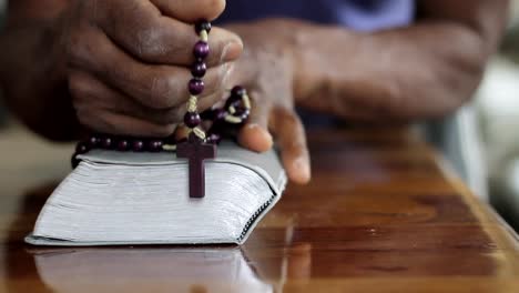 man-praying-to-God-with-hand-on-bible-with-people-stock-video-stock-footage