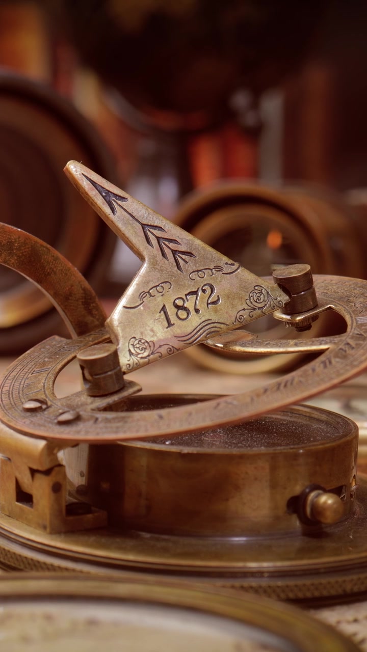Vintage style travel and adventure. Vintage old compass and other vintage items on the table.