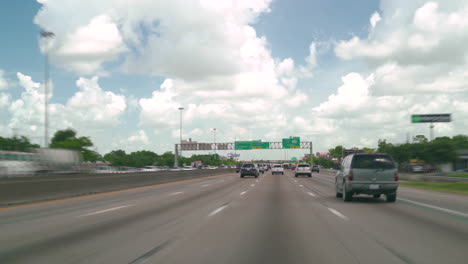 traffic timlapse driving car in the freeway. drive car on interstate 45 northbound toward downtown houston time-lapse. busy highway transportation timelapse in houston texas