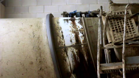 aged machinery coated in dust and dried concrete evokes the raw, gritty essence of labor. timeworn surfaces reflect stories of resilience and the quiet endurance of hard work.