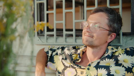 man in floral shirt outdoors