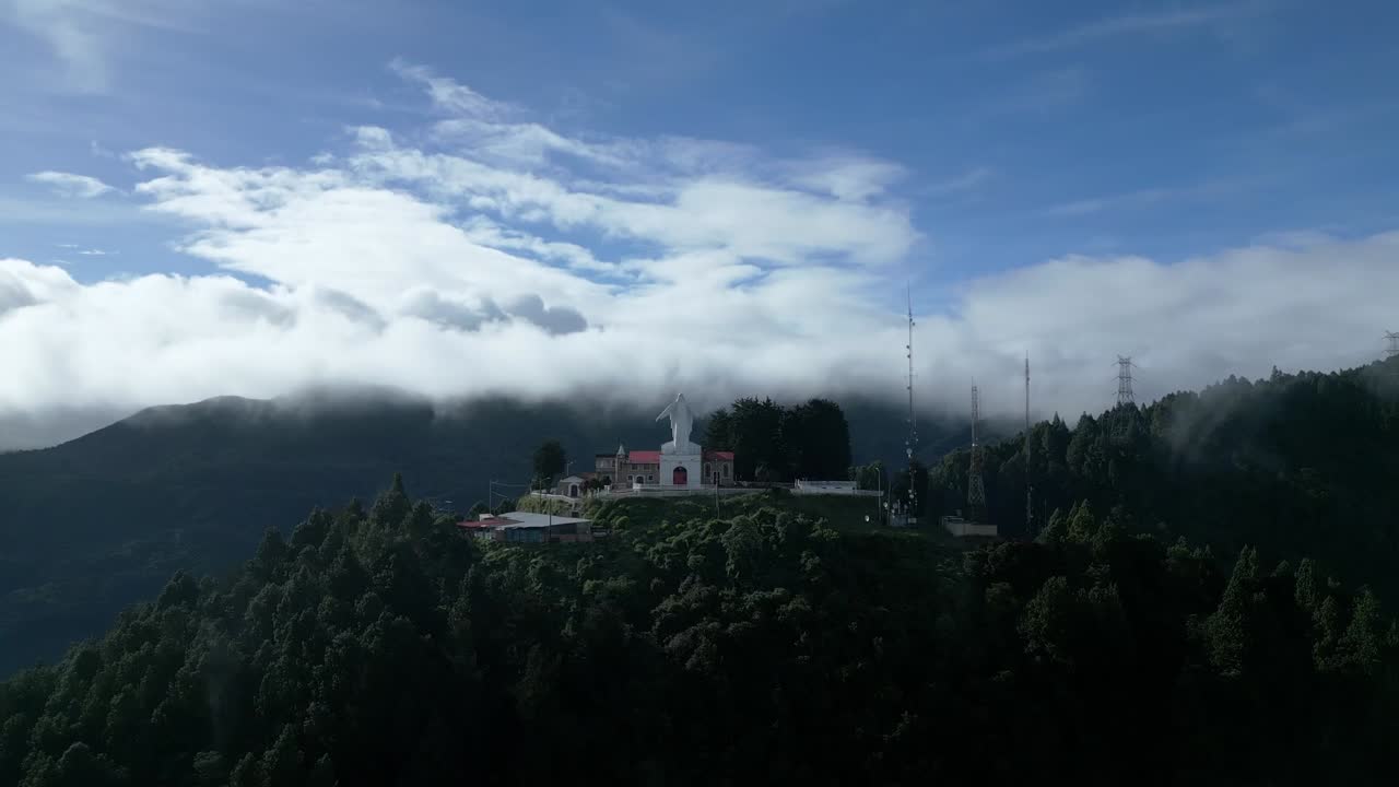 Wide drone aerial view of the Monserrate Hill Park church in Bogotá, Colombia