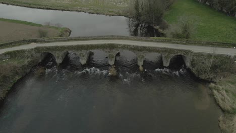 cinematic view of old stonebridge on slane river in wexford, ireland