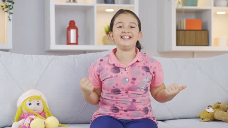 Girl-child-experiencing-joy-looking-at-camera.