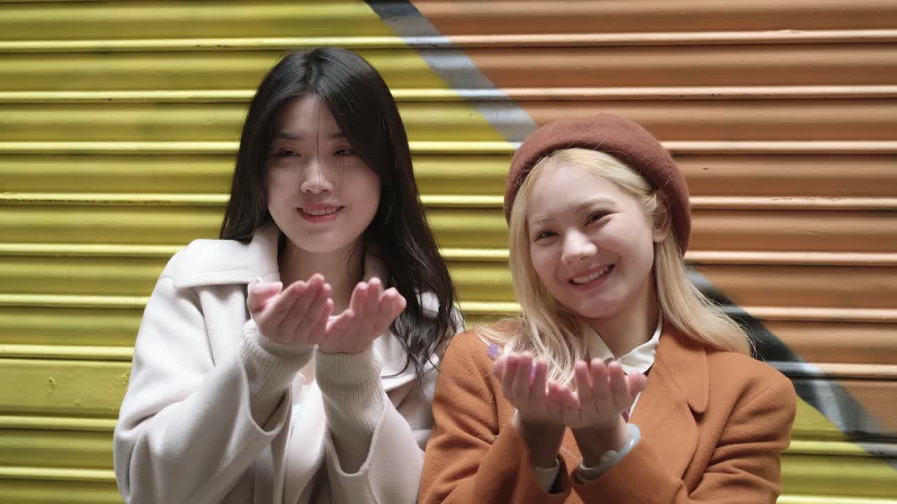 Two young women with confetti