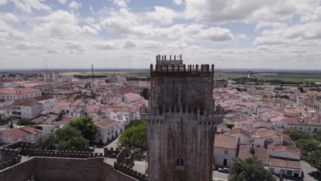 Aerial-view-of-cityscape-and-tower-of-Castle-of-Beja,-Portugal