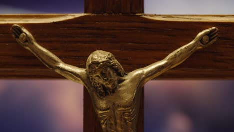 wooden crucifix with jesus against a serene sky close up