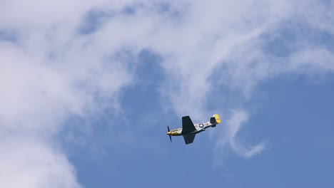 single airplane executing stunts in clear blue sky