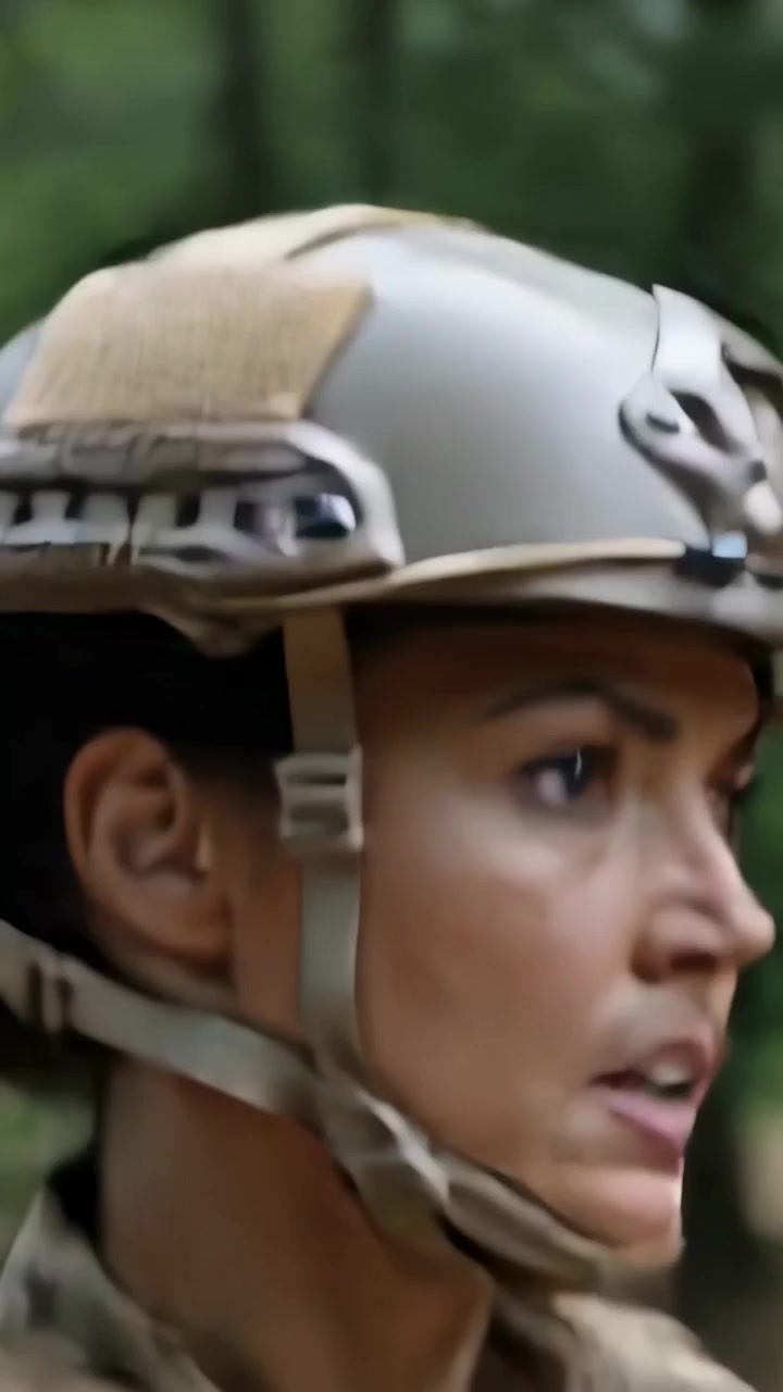 Vertical video: Reacting to sound, soldier moving and scanning forest with tan helmet and carrier