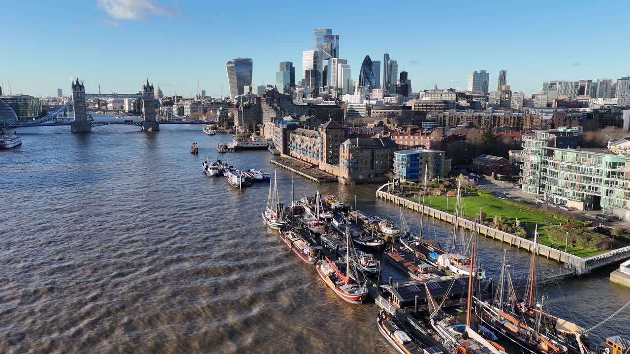 Old sailing barges and houseboats moored near Tower bridge London drone,aerial
