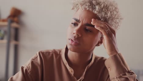 stressed exhausted young african american woman having strong tension headache