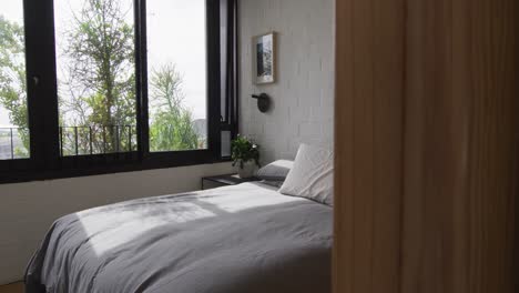 General-view-of-modern-bedroom-with-bed-and-window