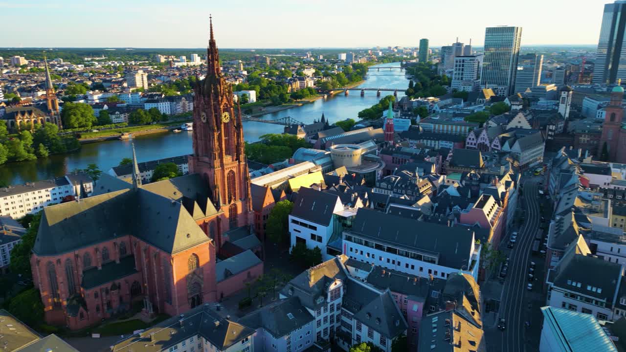 4K Drone Video of the Gothic-Style Kaiserdom St. Bartholomäus Cathedral and Evangelische Dreikönigskirche Church on the Main River in Downtown Frankfurt, Germany