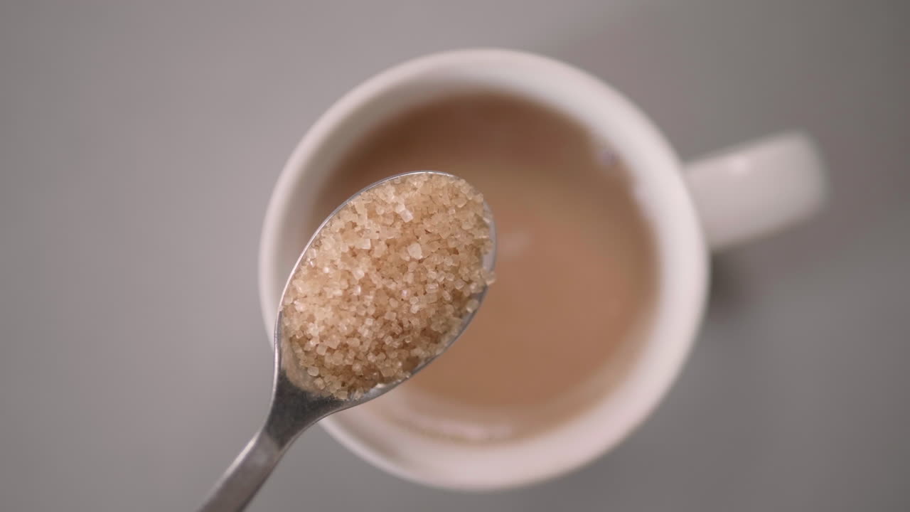 Overhead view of a cup of coffee with a spoon