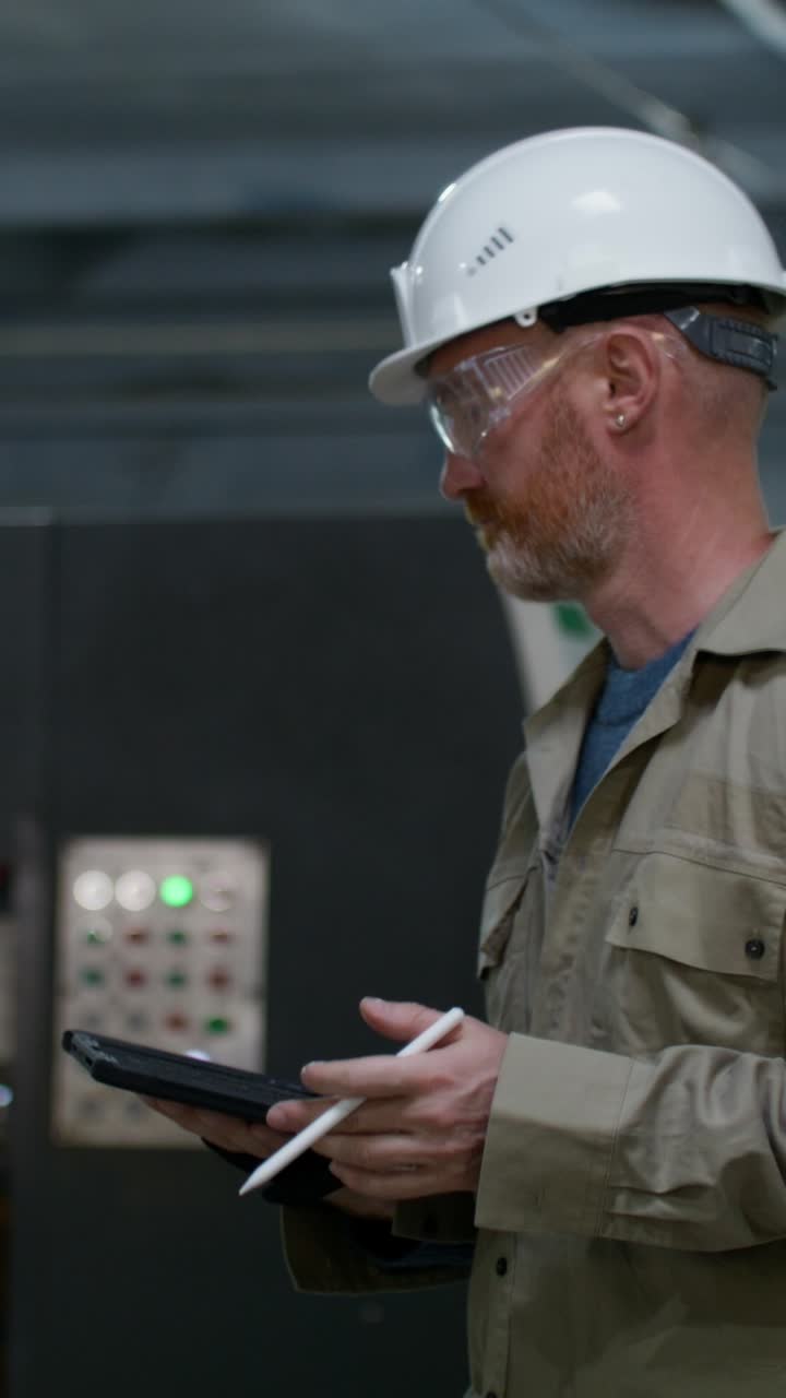 Industrial worker performing maintenance checks