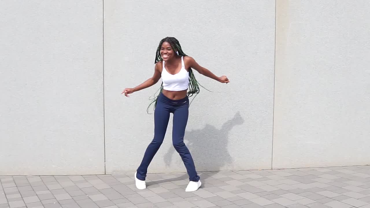 Cool black lady dancing freestyle on street