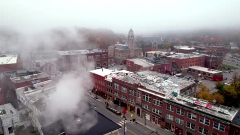 smoke and steam rise in the morning fog in montpelier vermont