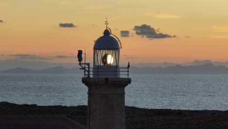 Long-aerial-zoom-of-Punta-Nati-Lighthouse-in-Spain