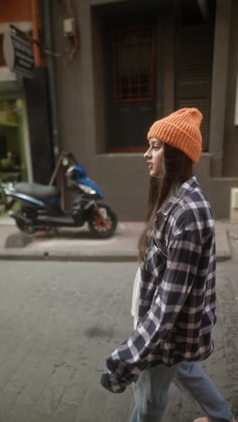 woman walking down a city street