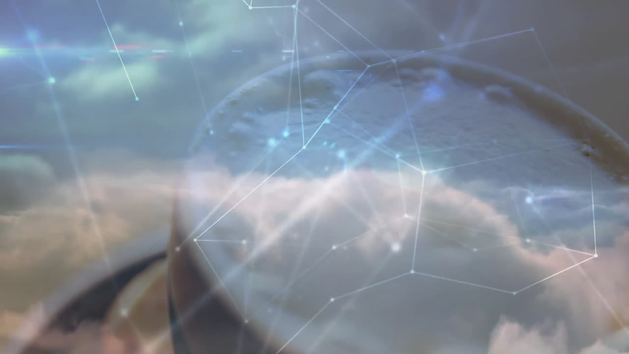 Cloudy sky being magnified through circular glass lens, showing network nodes and water droplets