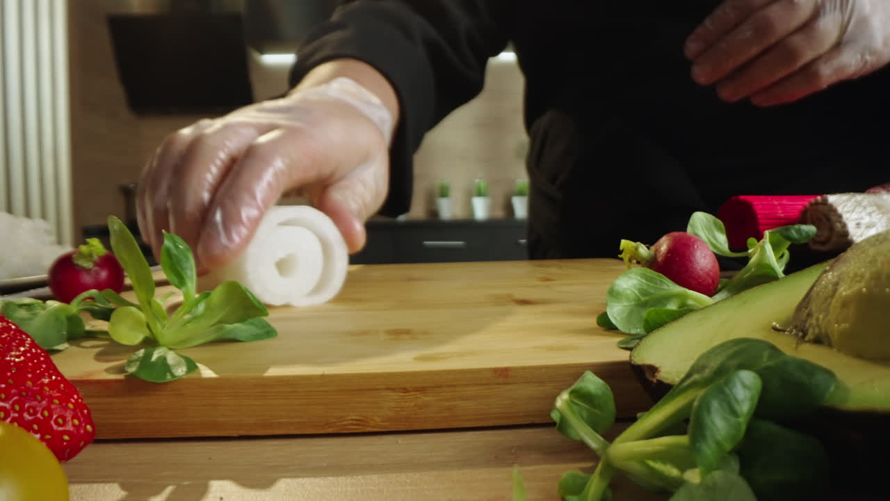 Chef preparing ingredients on a cutting board