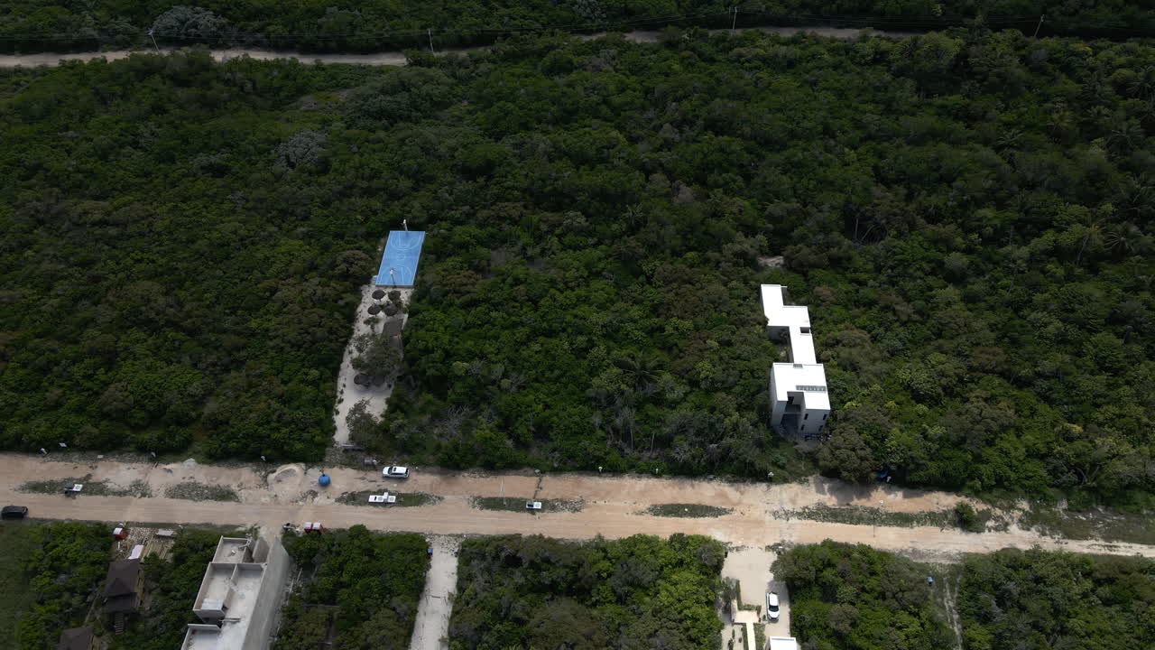 Sisal Aerial View 4K Empty Yucatan Beach On Mexican coast showing lots in sisal