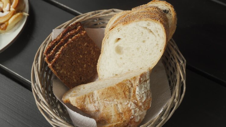 Freshly baked European bread on an outdoor breakfast board