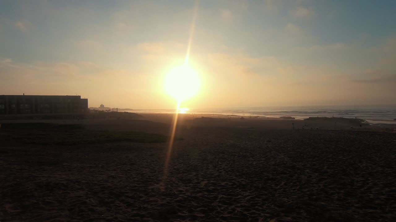 The Casablanca beach at sunset. Camera panning to the left.