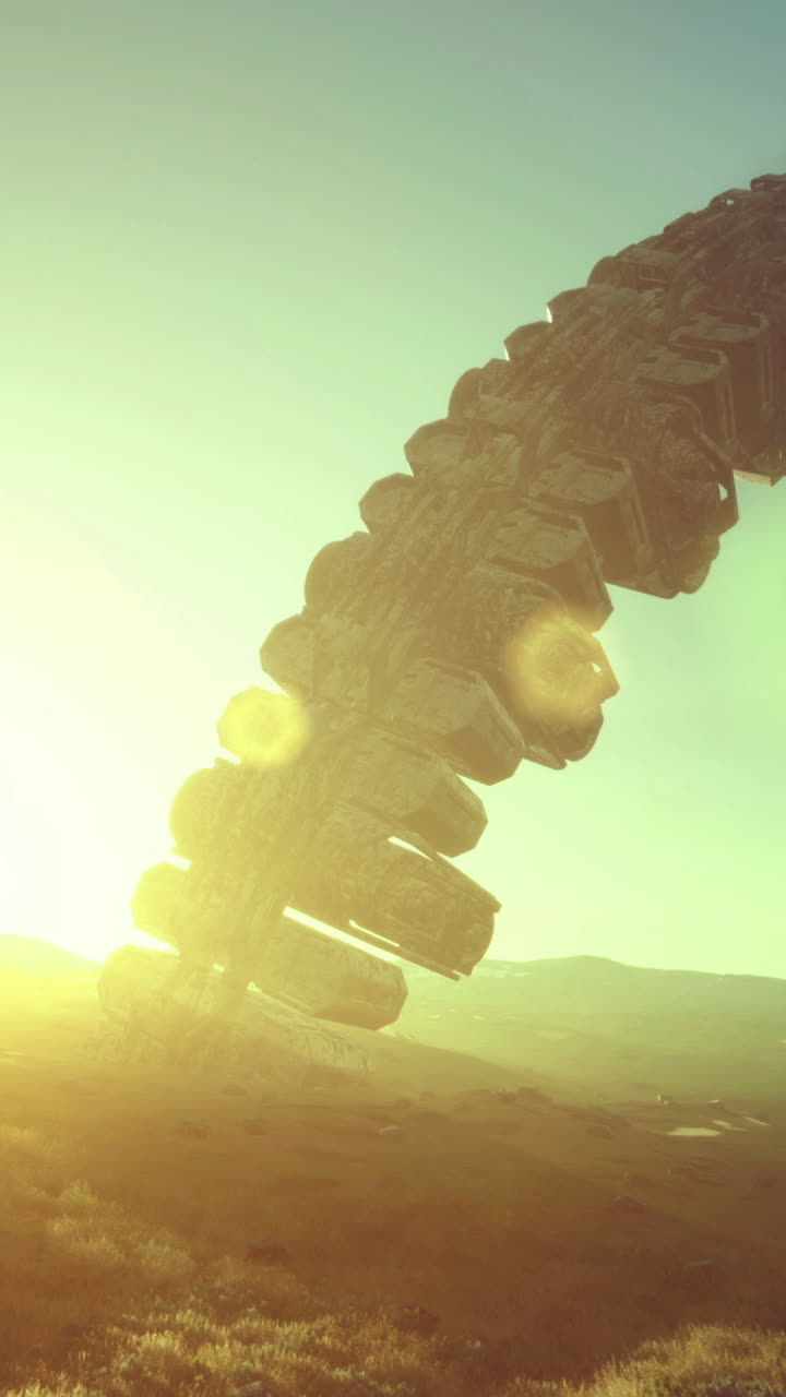 Mysterious alien craft hovers above a distant landscape at sunset