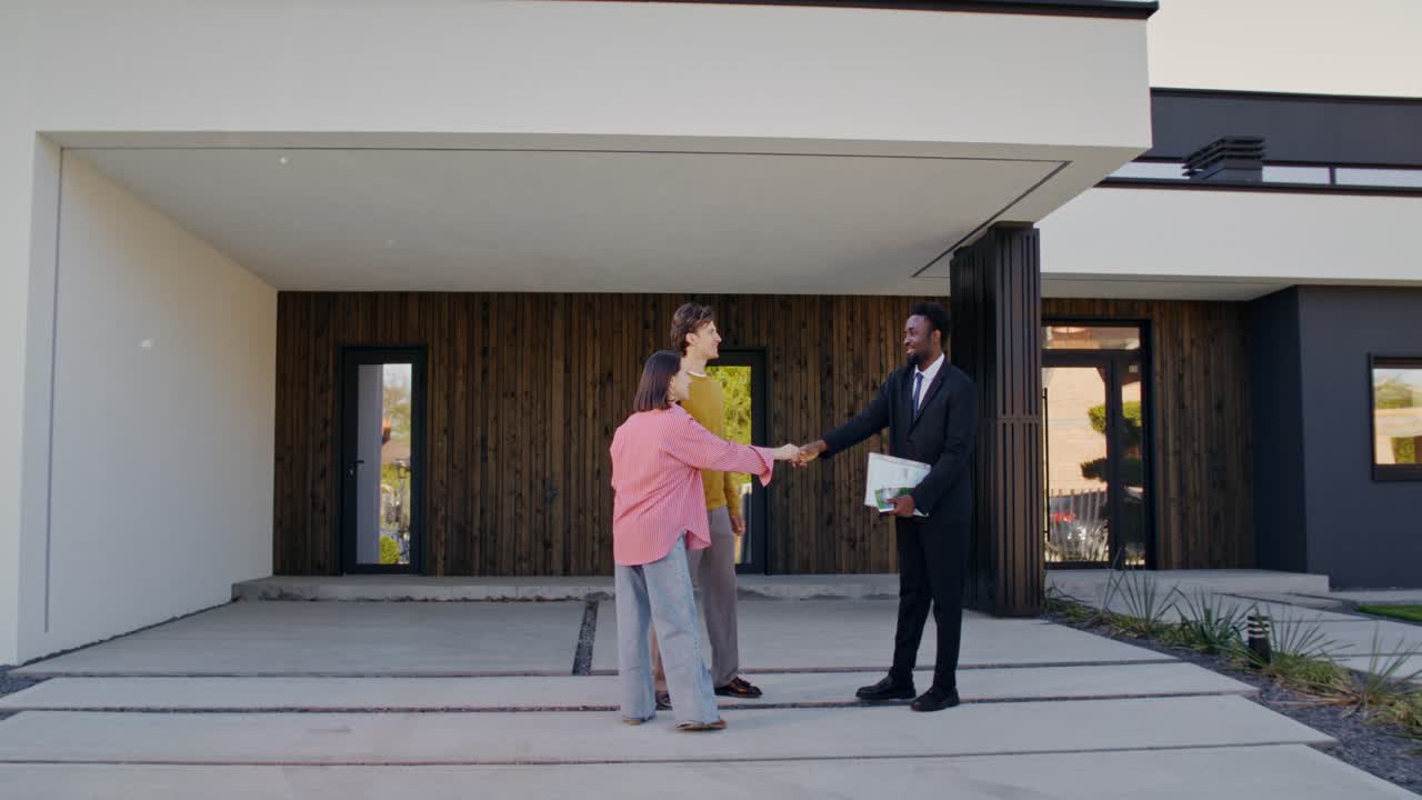 Real Estate Deal Closing - Couple and Agent