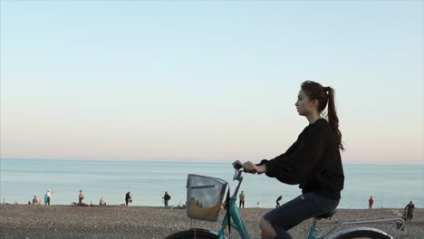 woman cycling on a beach