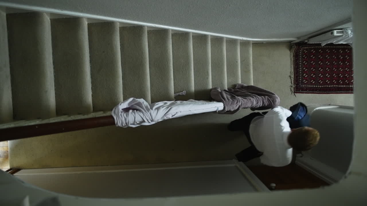 Businessman In The House Going To Work - overhead slowmo shot