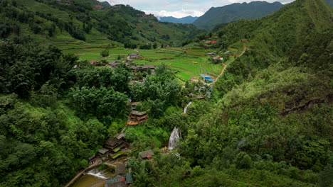 scenic cat cat village nestled in valley surrounded by lush mountains, aerial