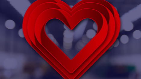 animación de un corazón sobre puntos de luz sobre un fondo negro