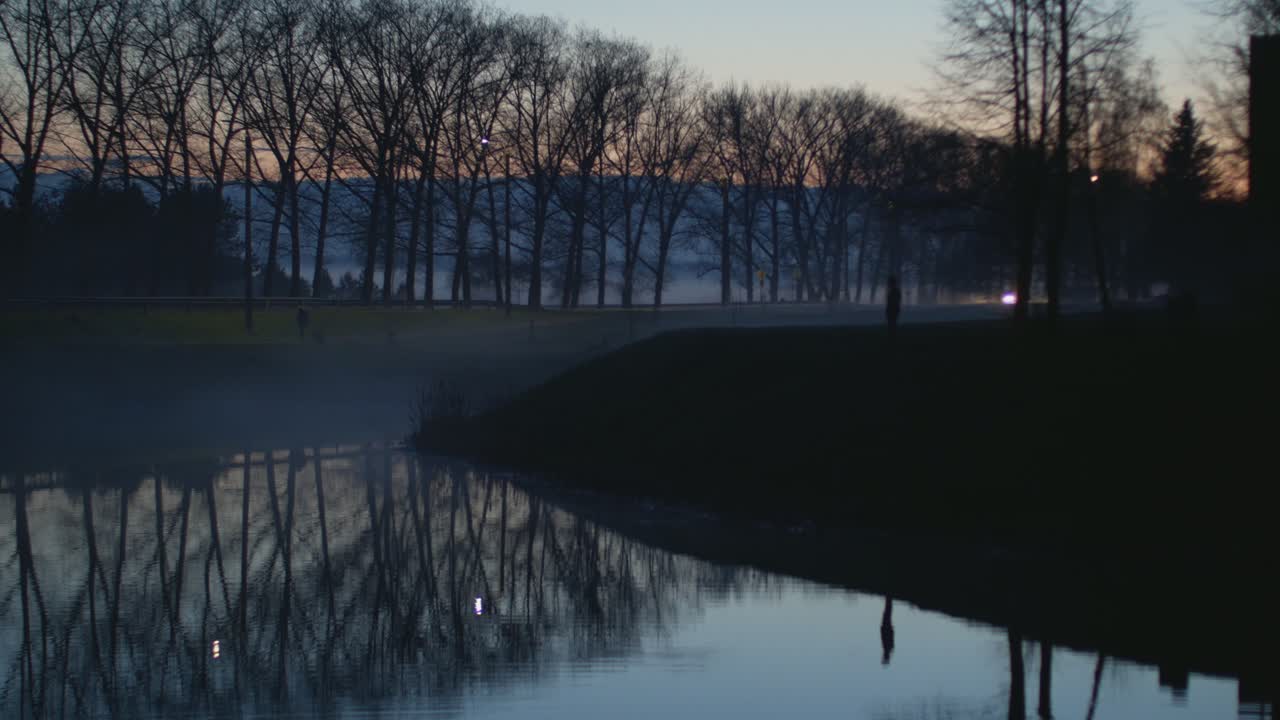 Car Traffic Light Reflections In The Water In The Evening. 4K Footage