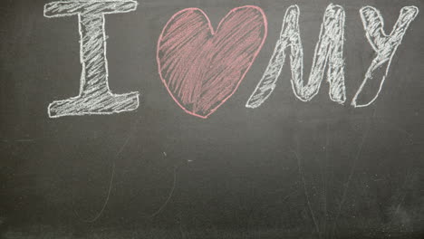 I-love-my-dad-message-appearing-drawn-on-blackboard-with-chalk