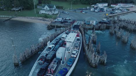 Aerial-Drone-shot-of-Ferry-approaching-Shelter-Island-North-Fork-Long-Island-New-York-before-sunrise