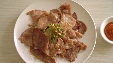 grilled pork neck sliced on plate in asian style