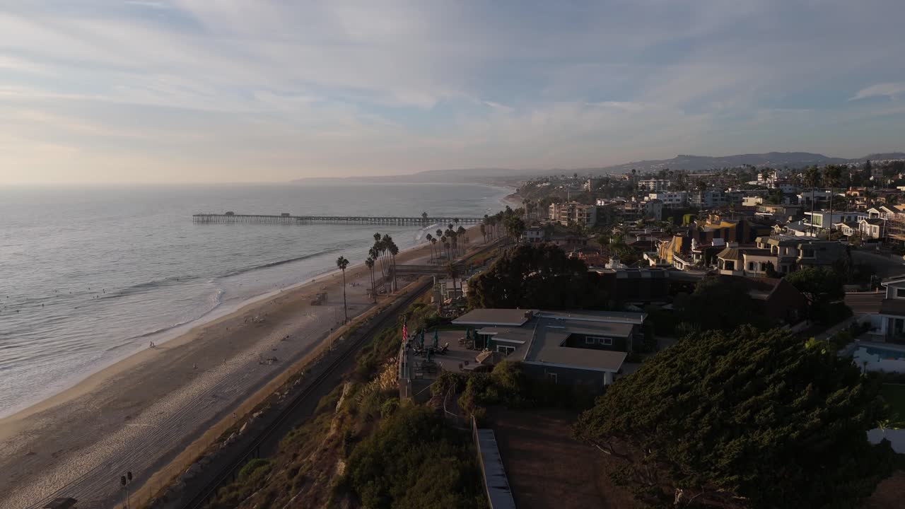 Aerial View of a Beautiful Coastal Town with a Beach and Pier